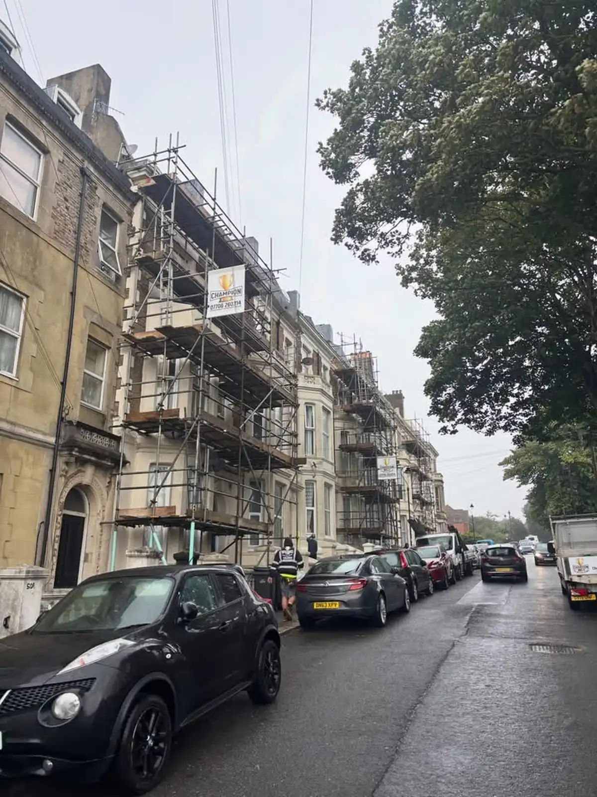 Champion scaffold to a run of period properties viewed along the street